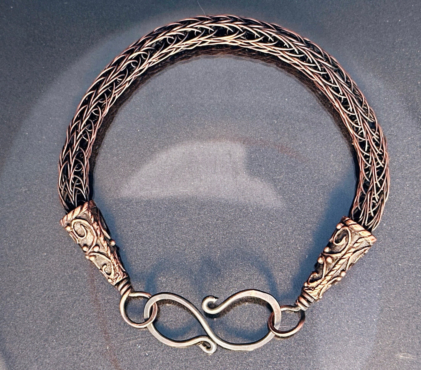 Viking knit copper bracelet with beautiful end caps.