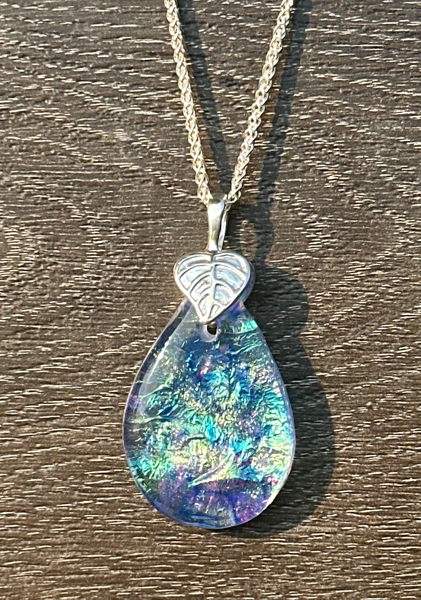 Hand etched and fused opalescent purple multicolor dichroic glass pendant with sterling silver bail and wheat chain.