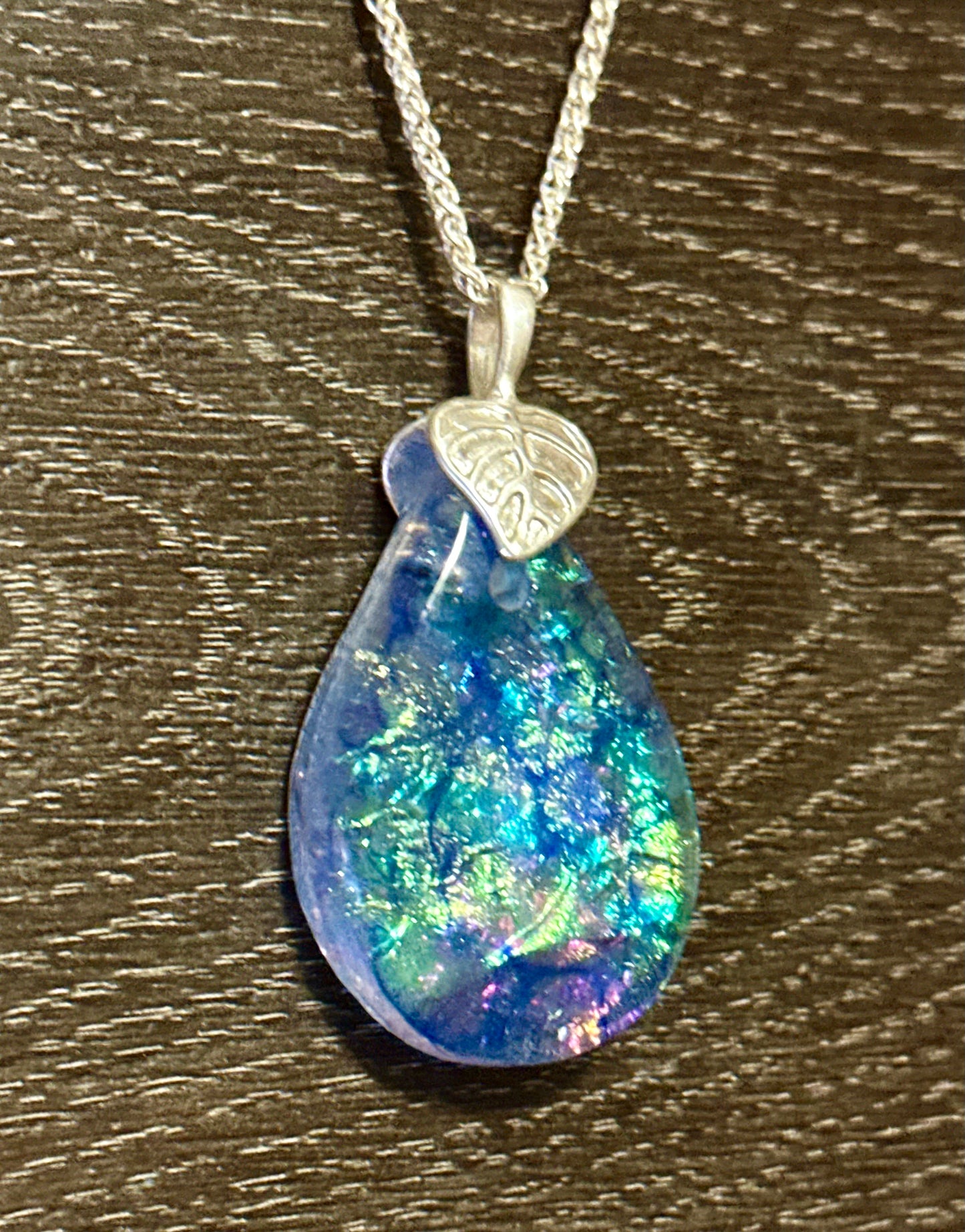 Hand etched and fused opalescent purple multicolor dichroic glass pendant with sterling silver bail and wheat chain.