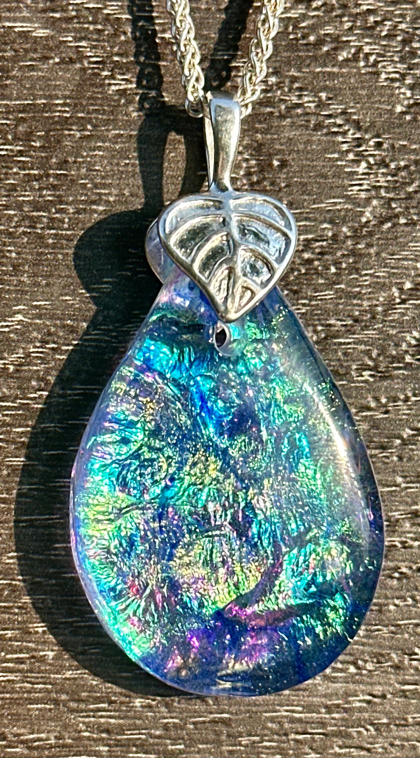 Hand etched and fused opalescent purple multicolor dichroic glass pendant with sterling silver bail and wheat chain.