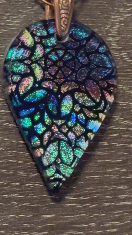 Hand etched and fused blue multicolor teardrop dichroic glass pendant with stained glass appearance.