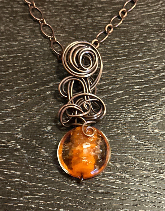 Orange glass bead with copper glitter flecks and copper freeform pendant